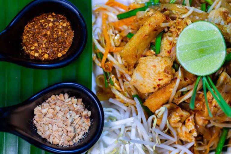 Pad Thai noodles served with lime and peanuts